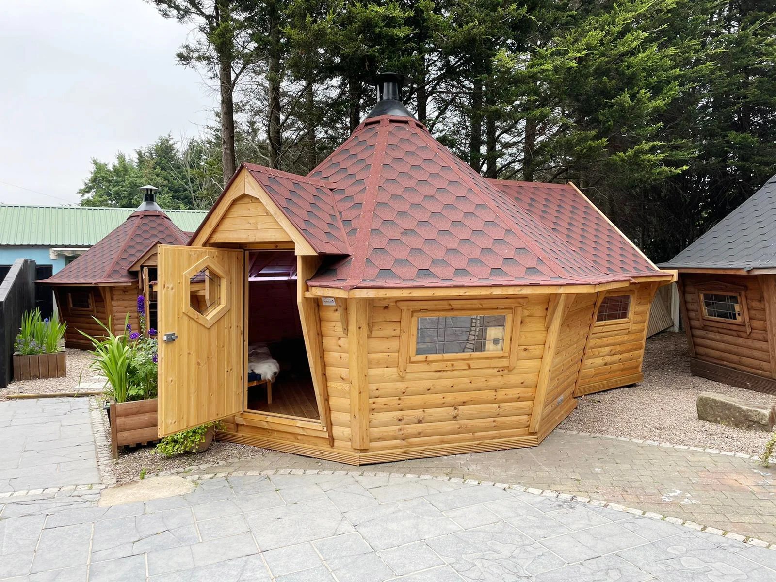 Arctic Cabins 14m garden bar with a BBQ grill
