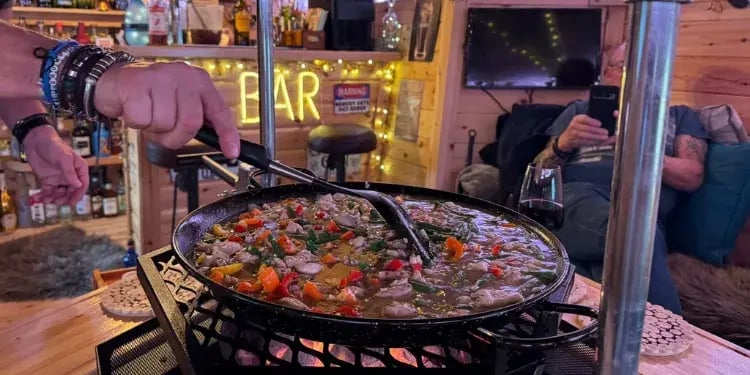cooking paella in an arctic cabin