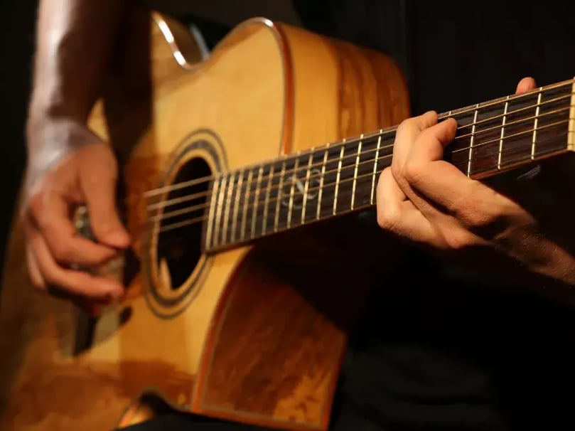 man playing a guitar