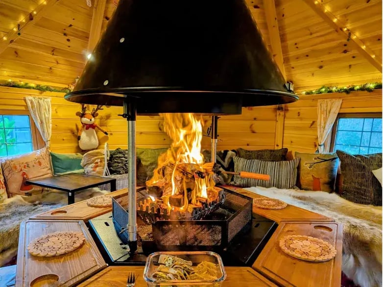 roaring fire inside a bbq cabin