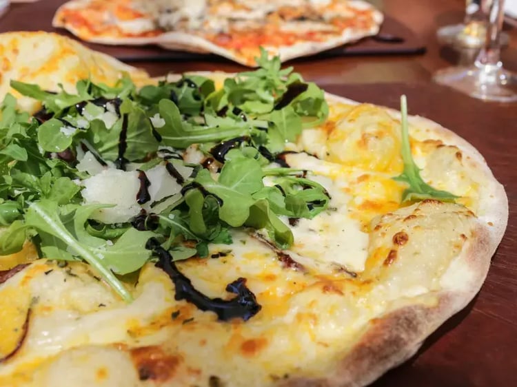 Close up of pizza cooked in a BBQ Grill Top Pizza Oven