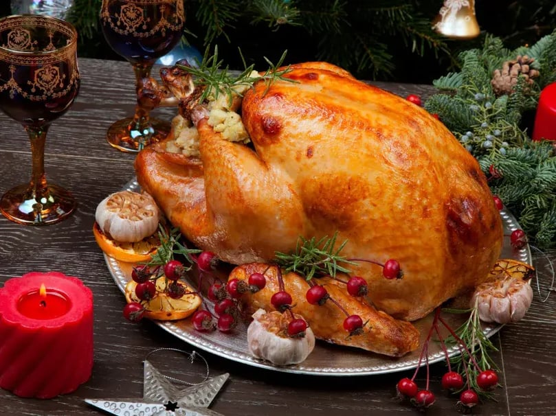 xmas turkey with trimmings on wooden table