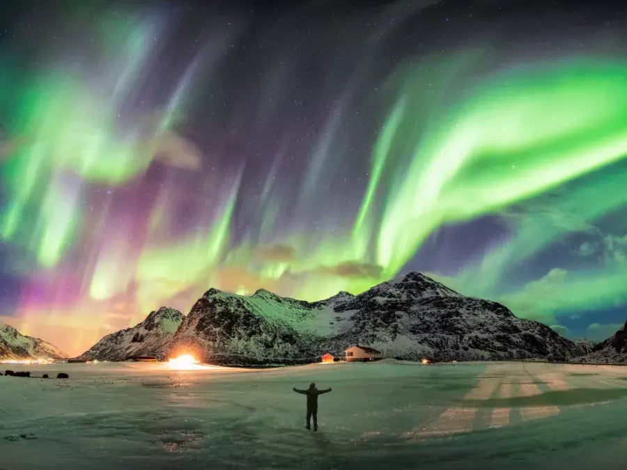 Man standing admiring the Northern Lights, Finland