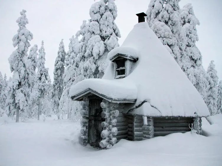 traditional bbq hut covered in snow in arctic finland