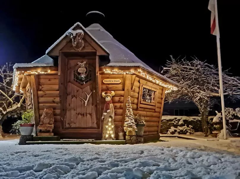 Snow covered Arctic Cabin Scandi BBQ hut