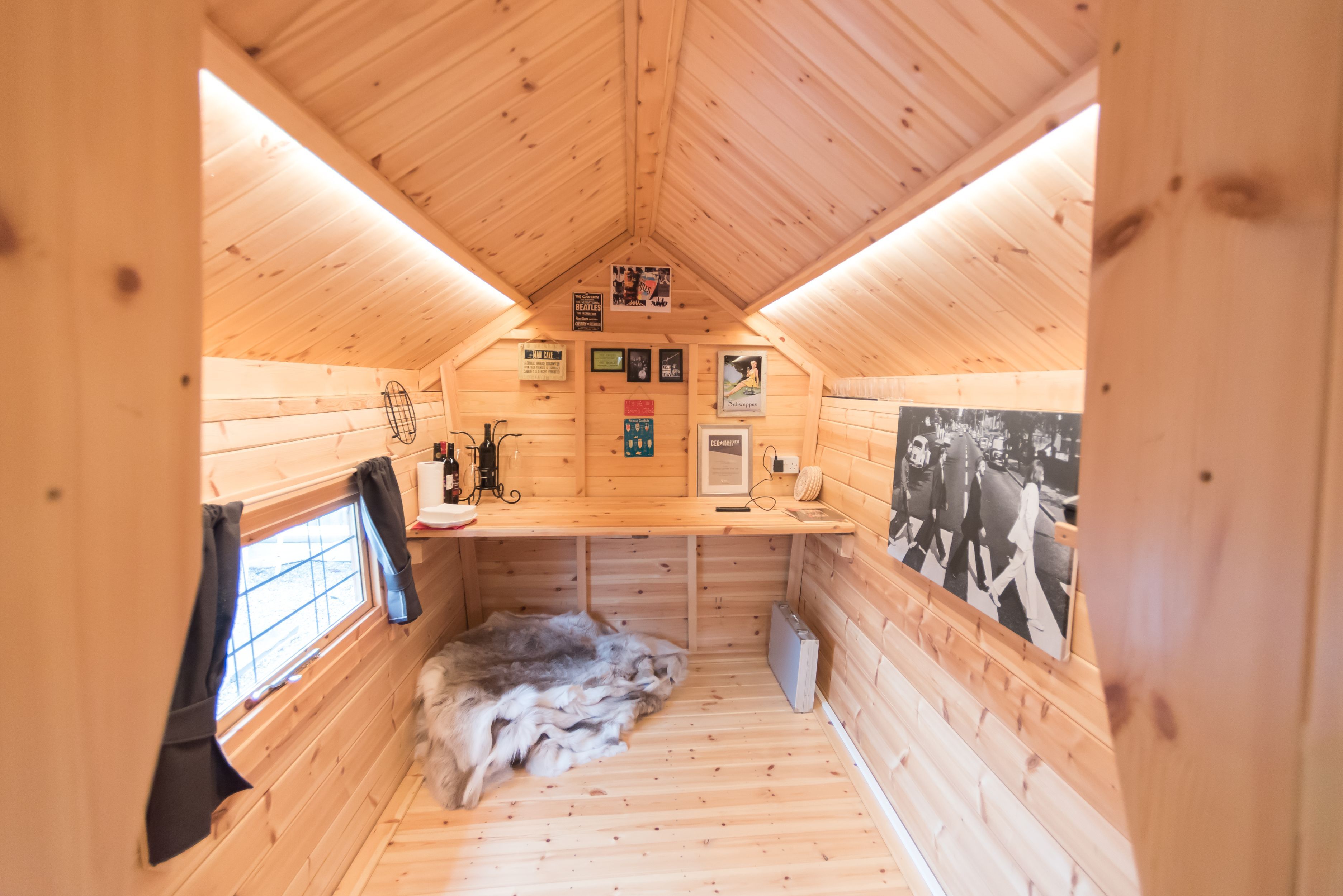 An office inside the extension of a barbecue cabin.