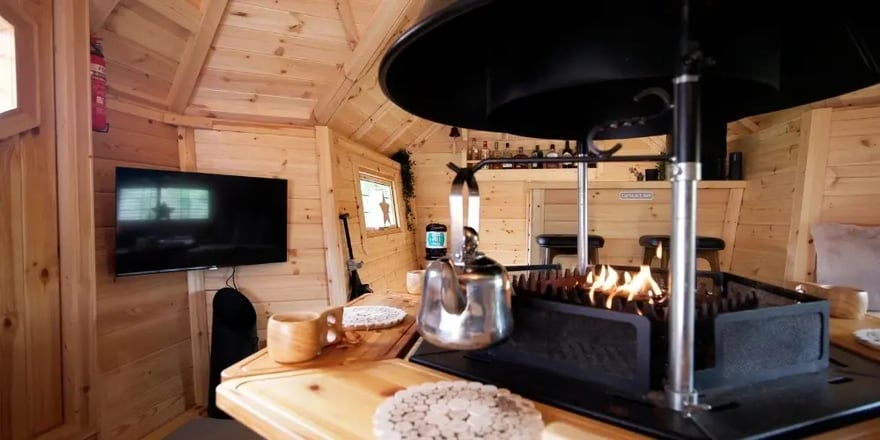 Scandi-style barbecue hut used as a cosy garden bar for drinks and relaxing