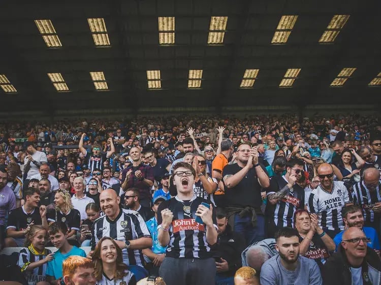 notts county fans celebrating goal
