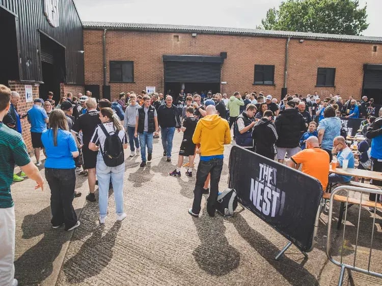 notts county fans at a busy fanzone
