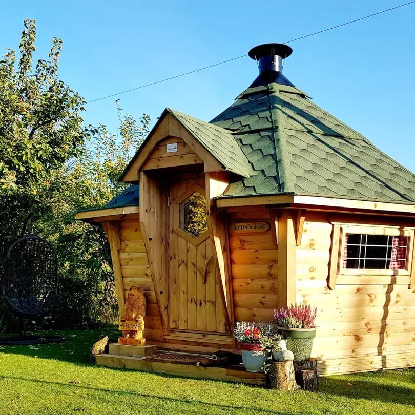 green roofed bbq cabin