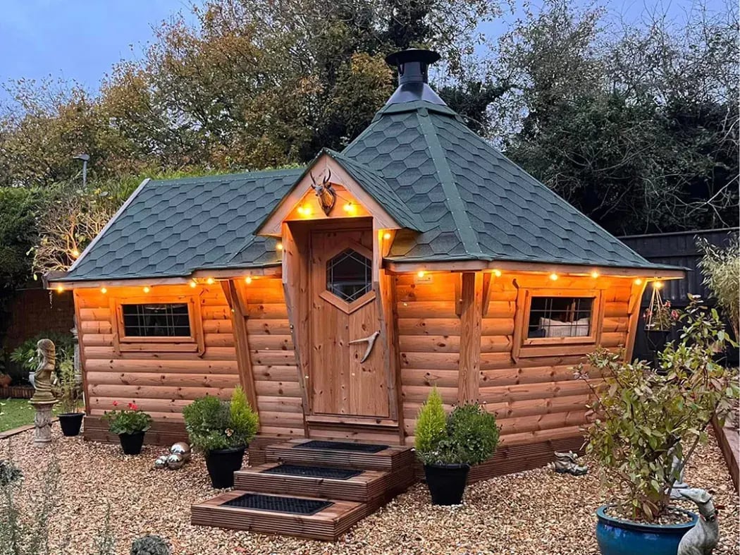 barbecue huts as the suns setting with fairy lights