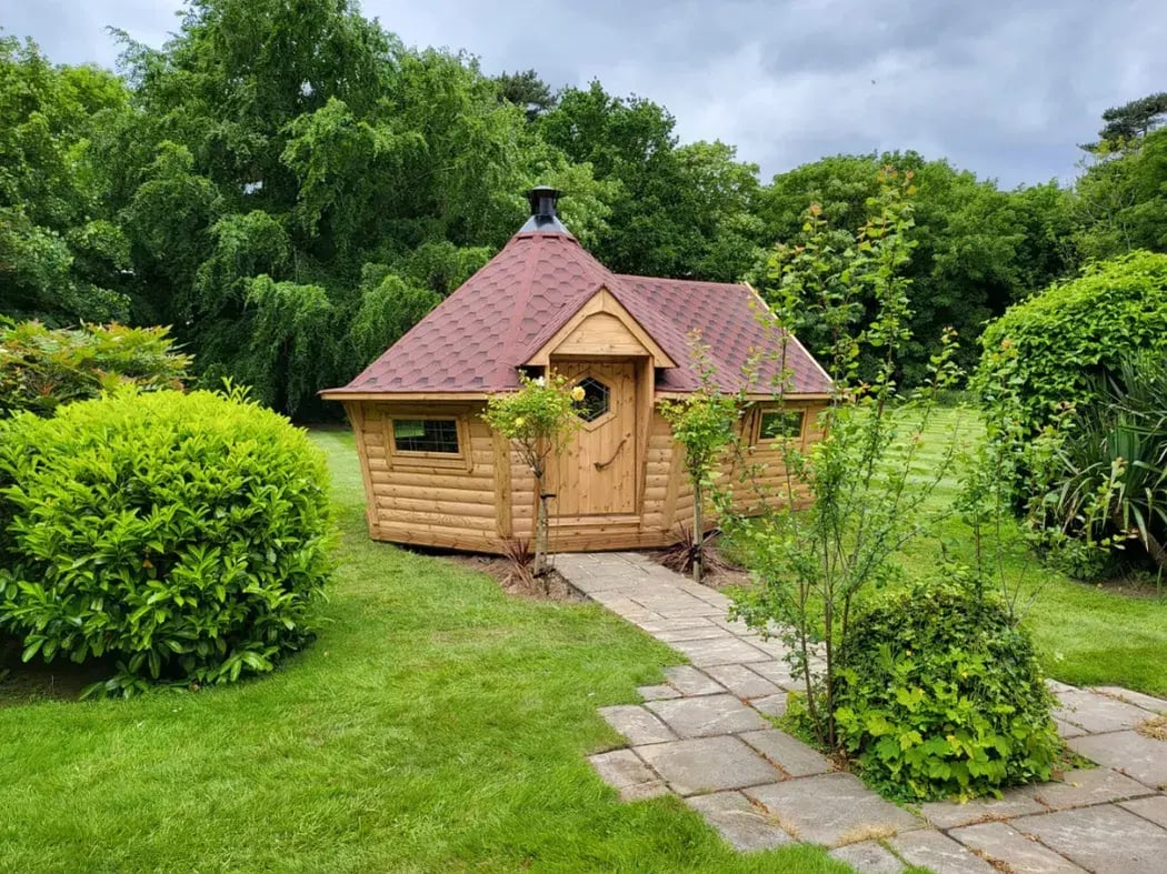 red roof barbecue house in a flourishing garden