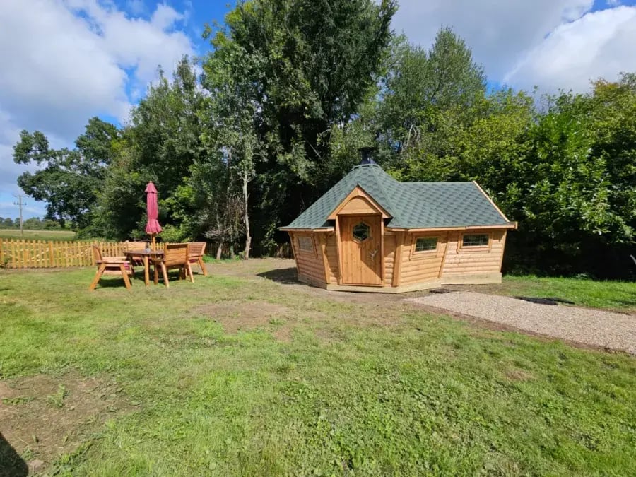 green roof cabin with bbq
