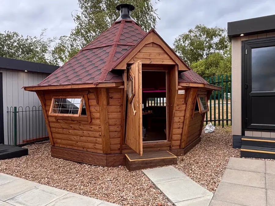 red roofed barbecue with doors and windows open