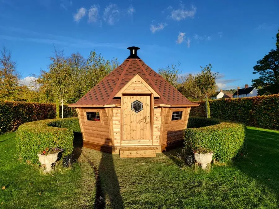 Large BBQ hut with a red roof 