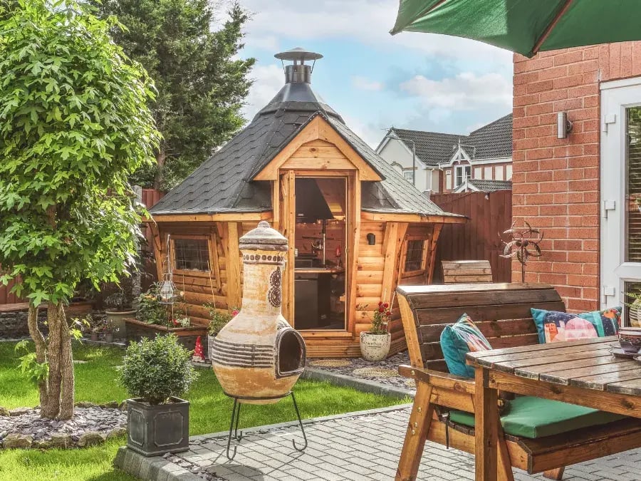 small BBQ hut with black roof