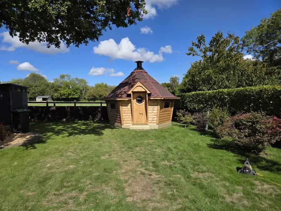 small bbq cabin with red roof