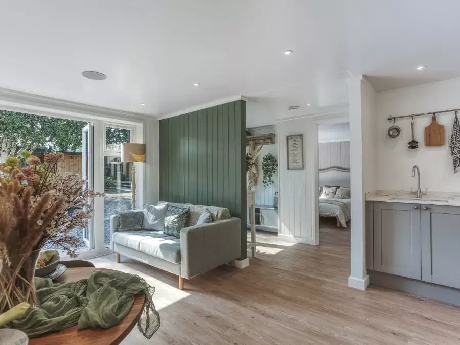 inside kitchen and living space with calm green interior 