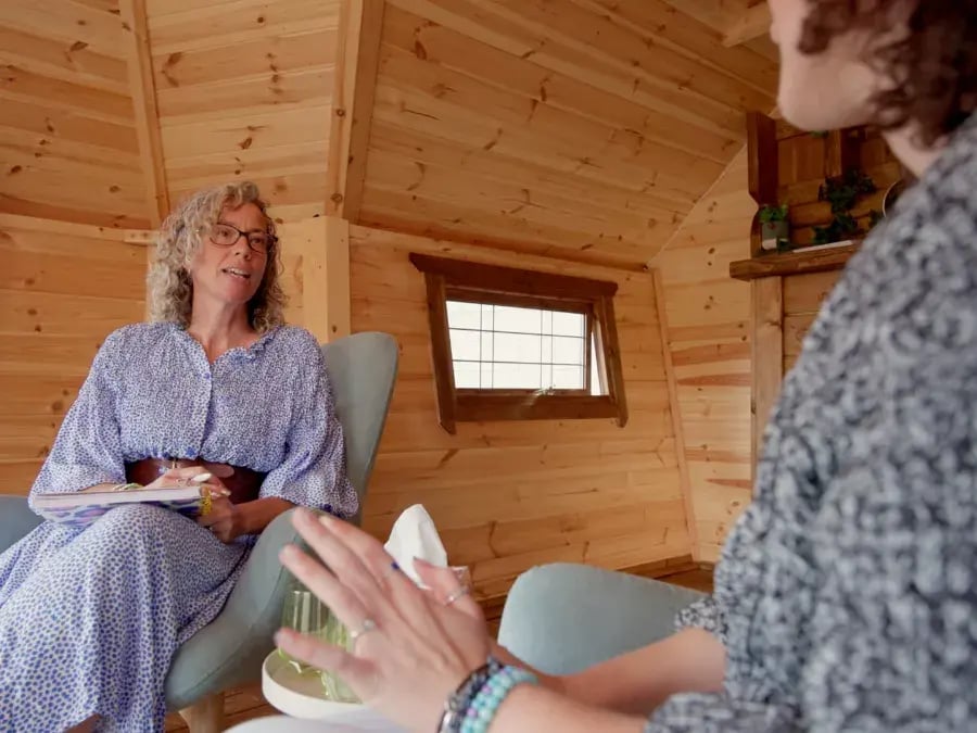 therapy session inside a garden cabin