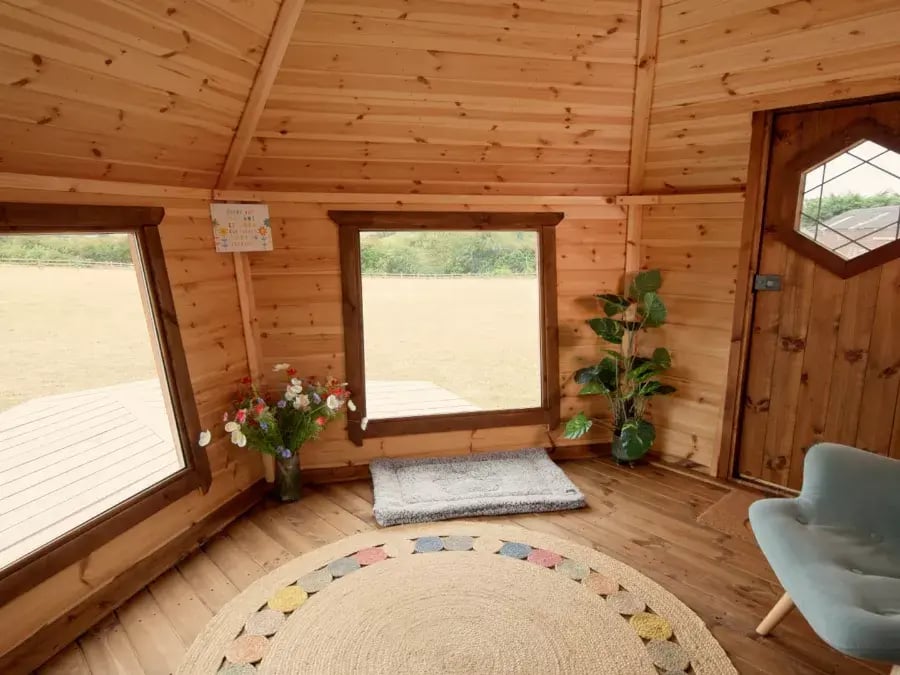 log cabin with large windows