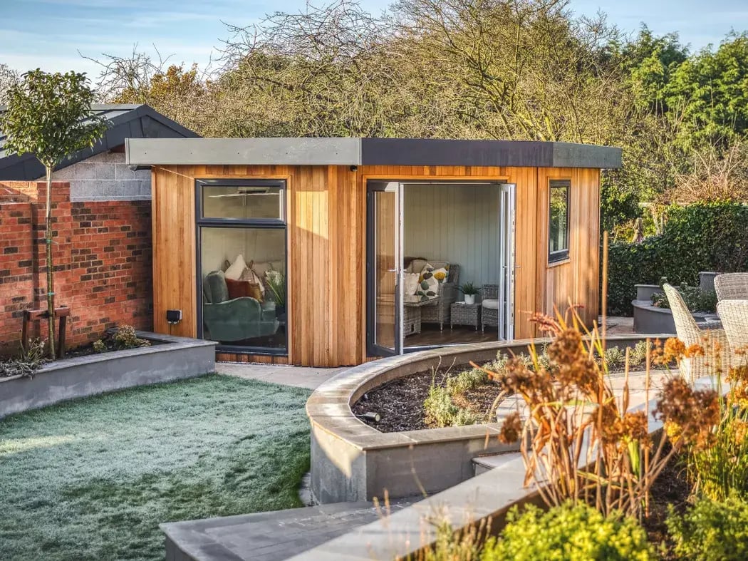 cedar cladding corner garden room with french doors