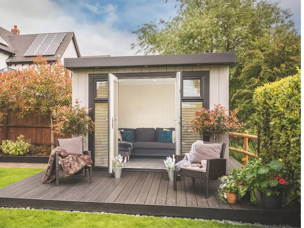 no maintenance garden room in light grey with outdoor seating 