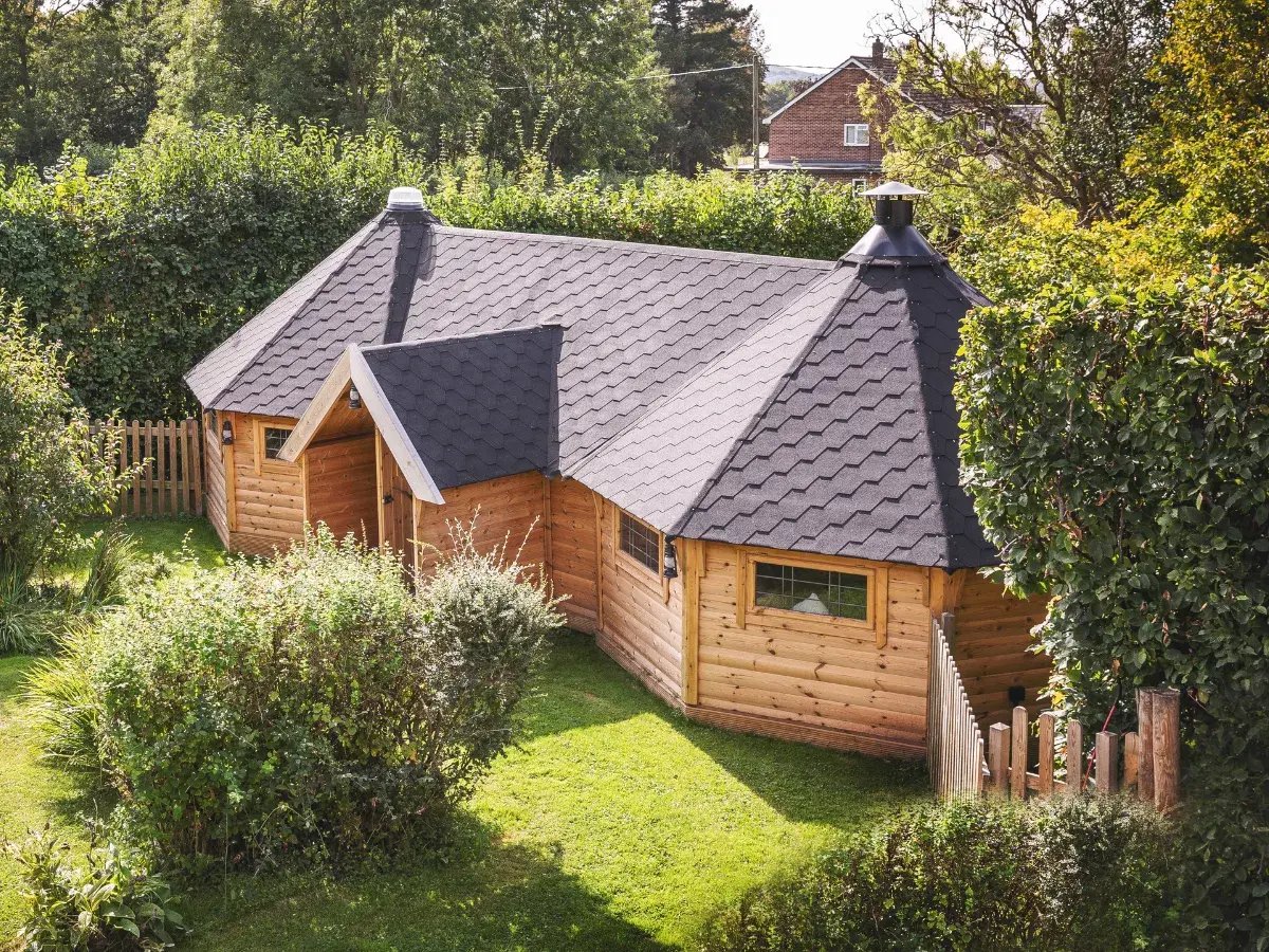 aerial view of two large joined garden retreat cabins