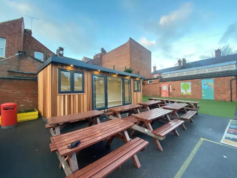 cedar outdoor classroom in playground of school