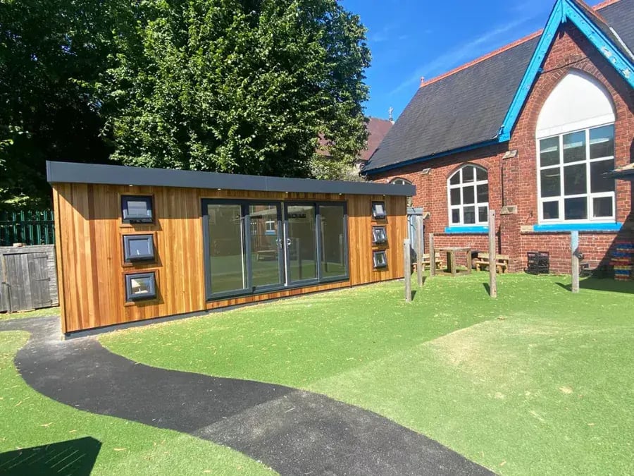 timber school cabin on playground