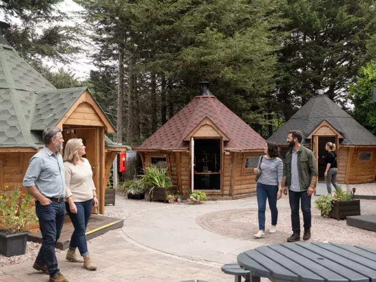 customers walking around the arctic cabins nottingham show site