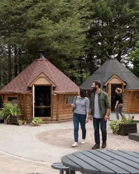 customers walking around the arctic cabins show site in nottingham