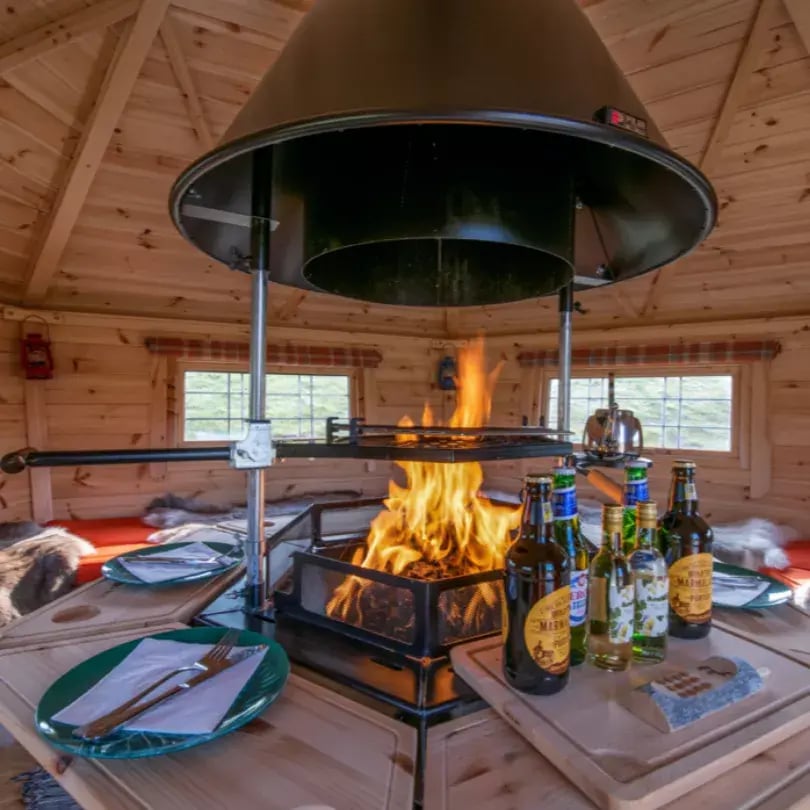 inside a bbq cabin with logs burning