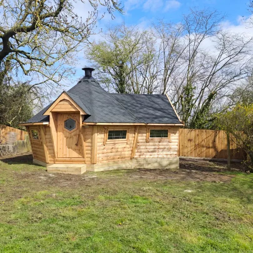 large garden bar building with bbq inside