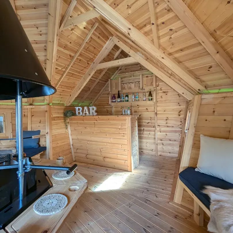 inside a large garden bar with barbeque inside
