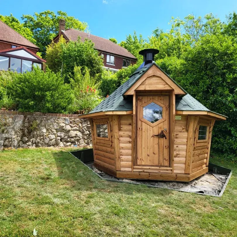 small grill cabin with green roof