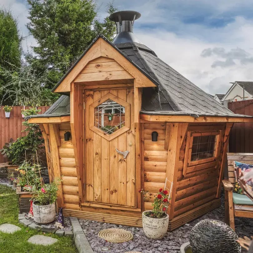 small outdoor hut in modern garden