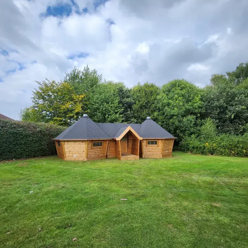 very large timber cabins joined together