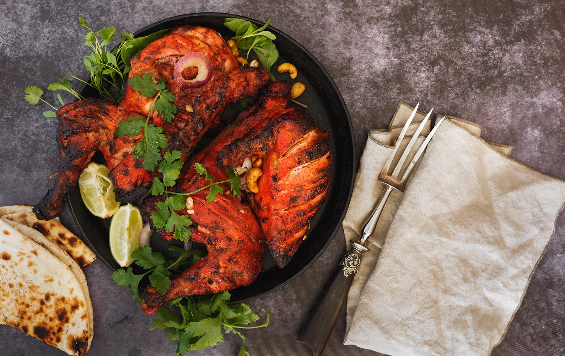 Marinaded BBQ chicken thighs in bowl with