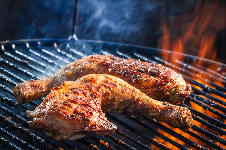 Chicken wings cooking on a BBQ grill