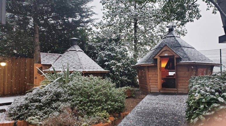 Snow covered Arctic Cabins Grill Huts at the Nottingham show site