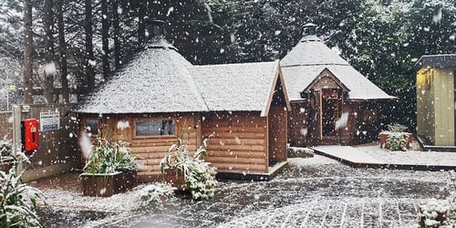 Snow covered BBQ cabins at the Nottingham show site