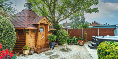 BBQ hut in garden with hot tub nearby
