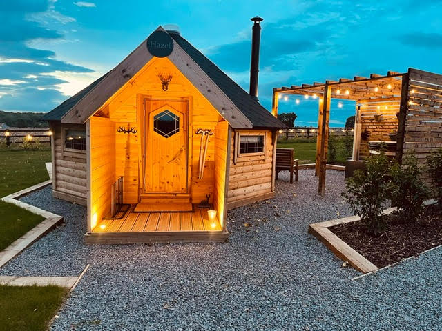 Log Cabin BBQ at dusk, by Arctic Cabins