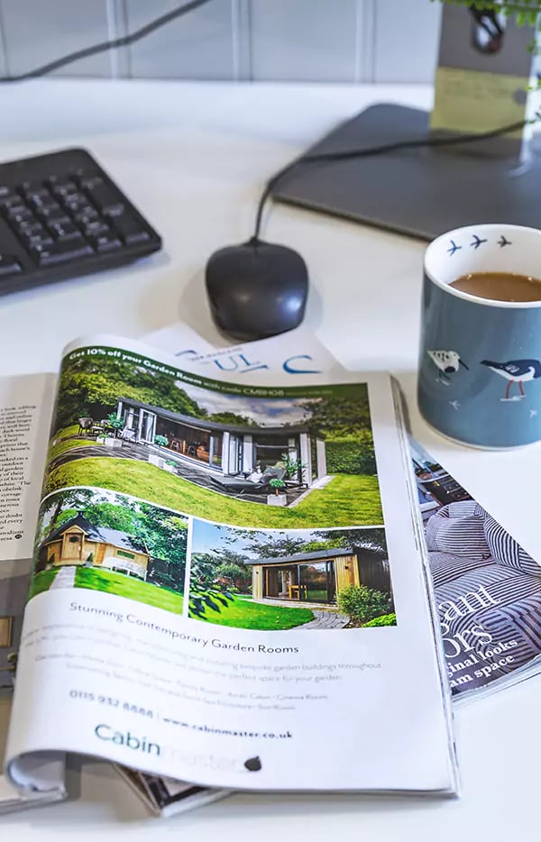 garden room brochure open on desk