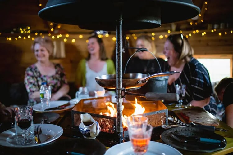 people having party inside a grill cabin