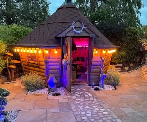 barbecue hut lit up in the night