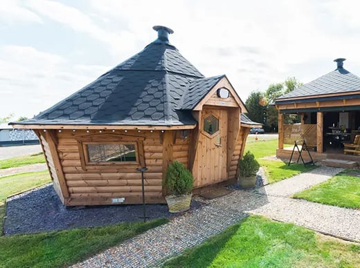 Garden BBQ huts created as all season BBQ hut spaces for relaxing, cooking, and entertaining outdoors