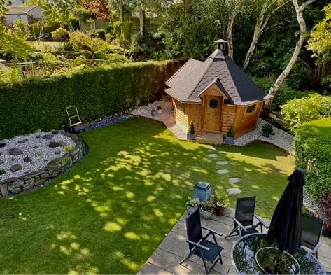 A garden bar in the corner of a garden.