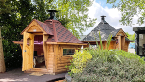 Red roofed 7m BBQ Cabin At the Arctic Cabins Nottingham Show Site