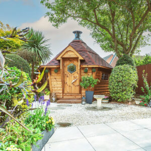 10m² luxury timber BBQ house in garden with paved area